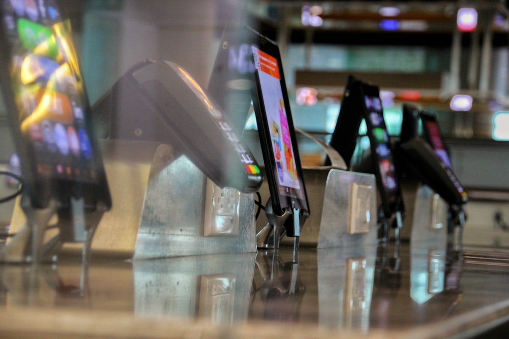 black and white smartphone on glass table