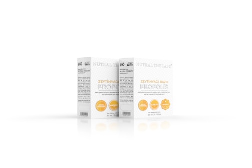 Two boxes of a product labeled 'Nutral Therapy' and 'Zeytinyağ Bazlı Propolis' with details about its ingredients and volume. The design is simple with white and yellow accents, featuring circular icons indicating certain attributes such as honesty therapy, alcohol-free, and patented.