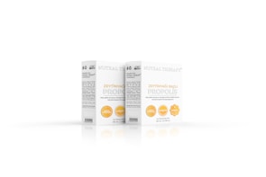 Two boxes of a product labeled 'Nutral Therapy' and 'Zeytinyağ Bazlı Propolis' with details about its ingredients and volume. The design is simple with white and yellow accents, featuring circular icons indicating certain attributes such as honesty therapy, alcohol-free, and patented.
