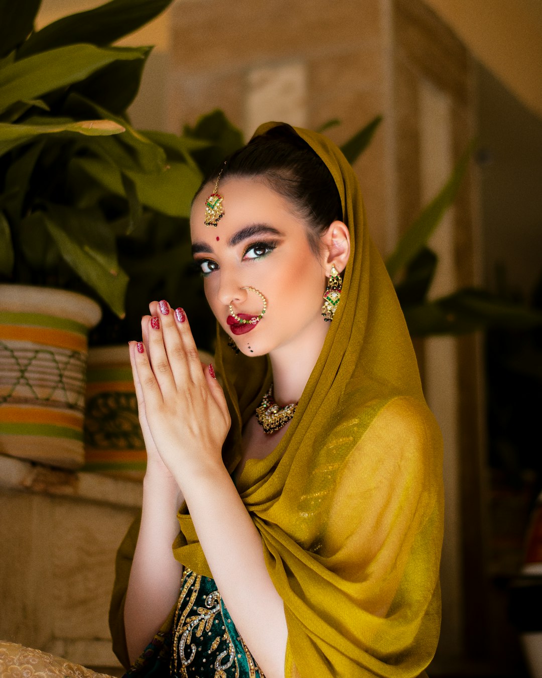 woman in yellow hijab and blue and white floral dress