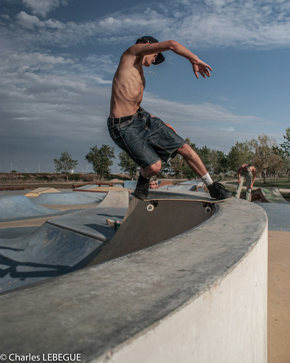 man in black shorts doing skateboard stunts on skateboard ramp during daytime