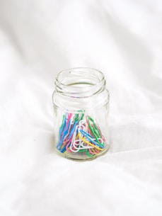 clear glass jar with green white and red liquid