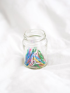 clear glass jar with green white and red liquid