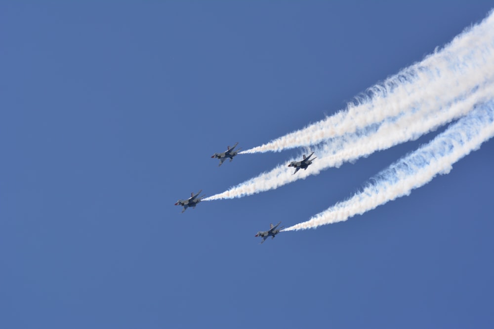 four fighter planes in mid air