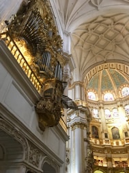A grand pipe organ in a cathedral bathed in soft, ethereal light.
