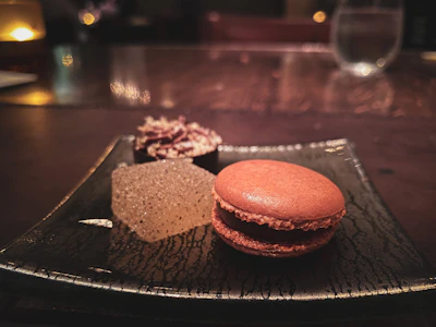 Artistic close-up of a glowing dessert plate with futuristic plating and subtle animated light effects.