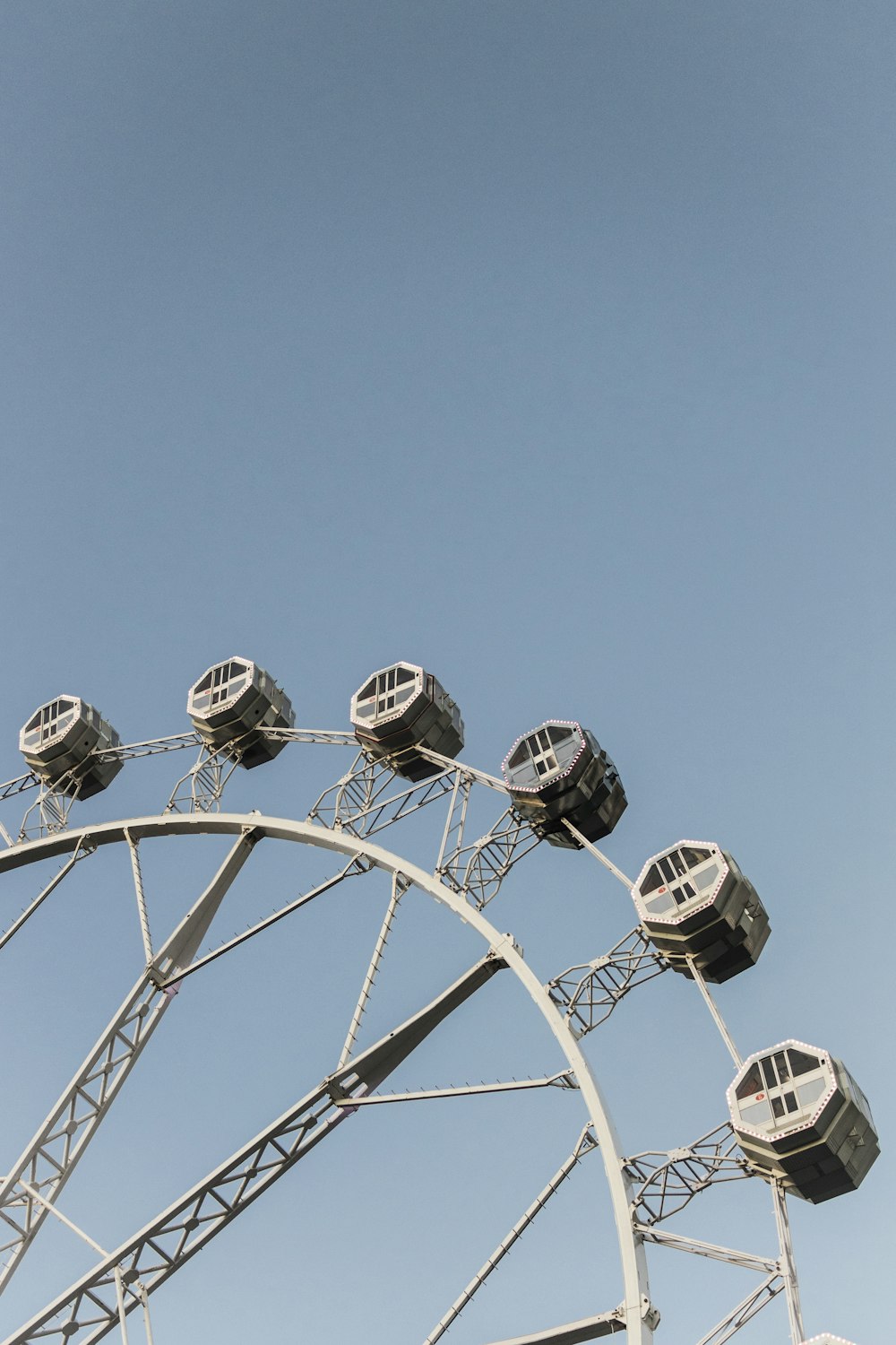 white ferris wheel under blue sky during daytime