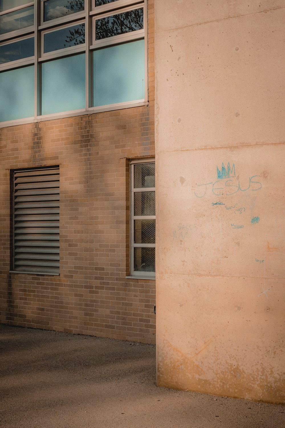 brown wooden window on brown concrete building during daytime