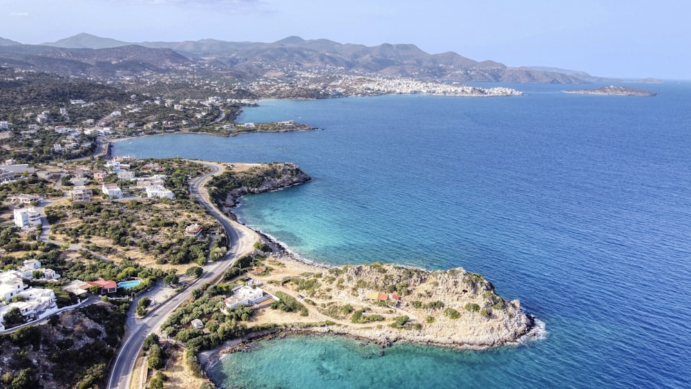 aerial view of green trees and blue sea during daytime