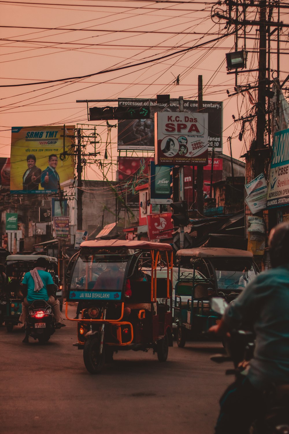 red and black auto rickshaw on road during daytime