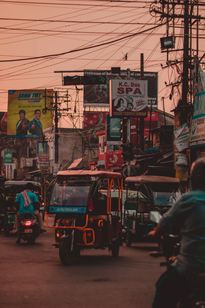 Auto rickshaw on an Indian road — urban OOH and transit context
