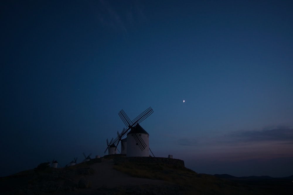 silhouette of windmill during night time