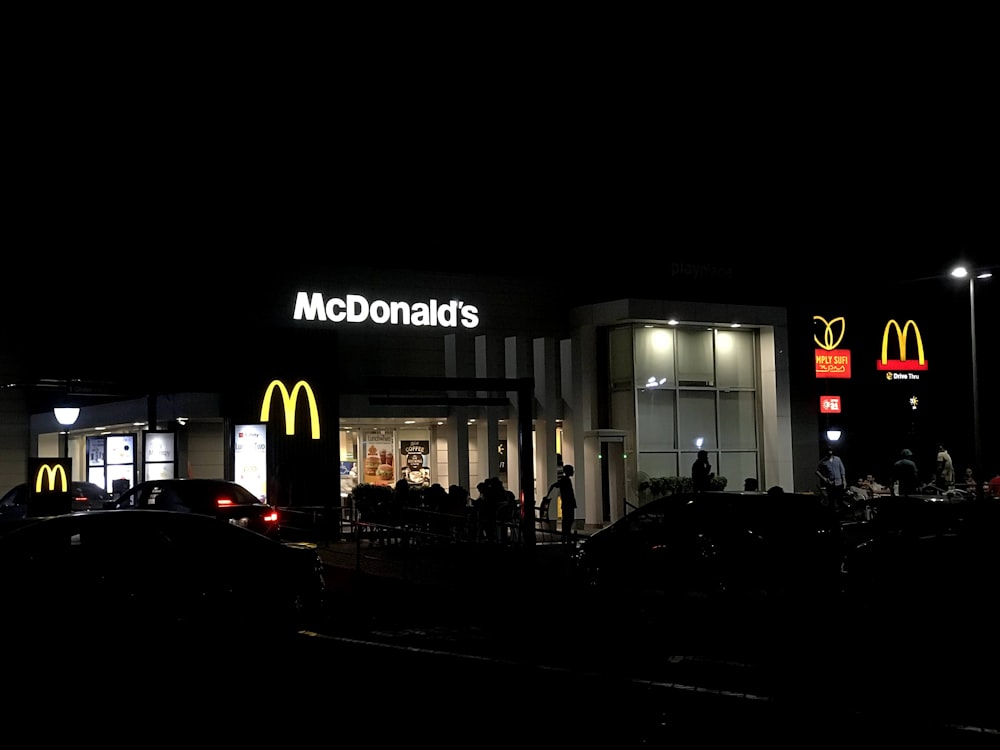 McDonald's shop during night time where its logos are distinctly visible