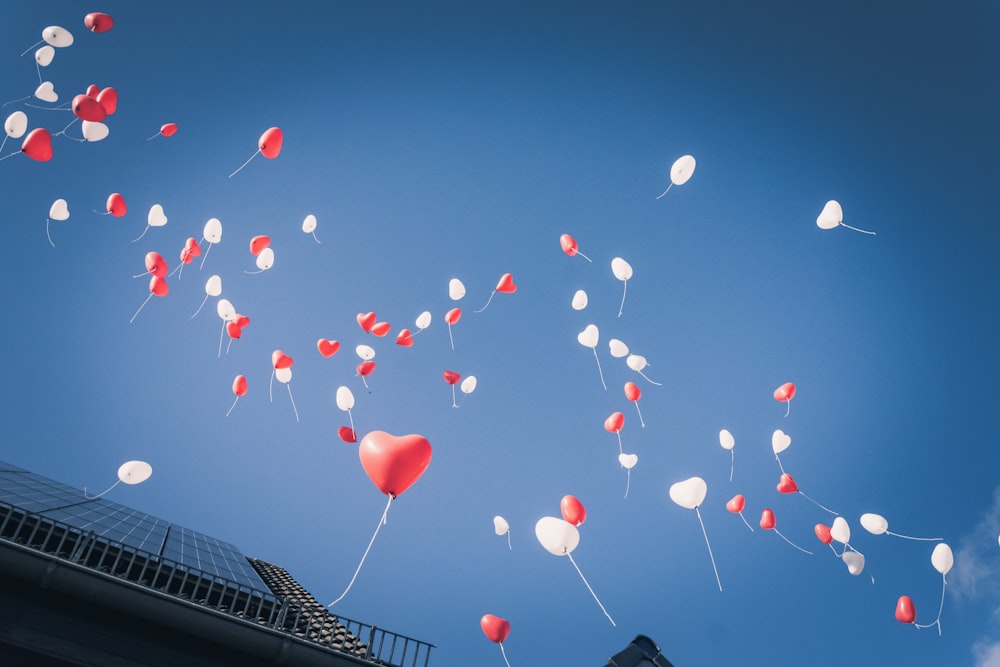 red heart balloons on sky during daytime