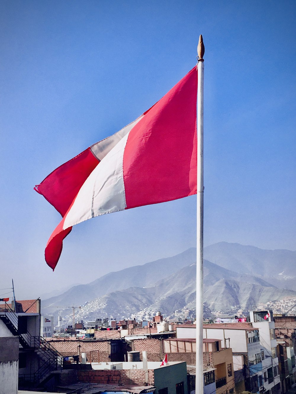 white red and blue flag on pole during daytime