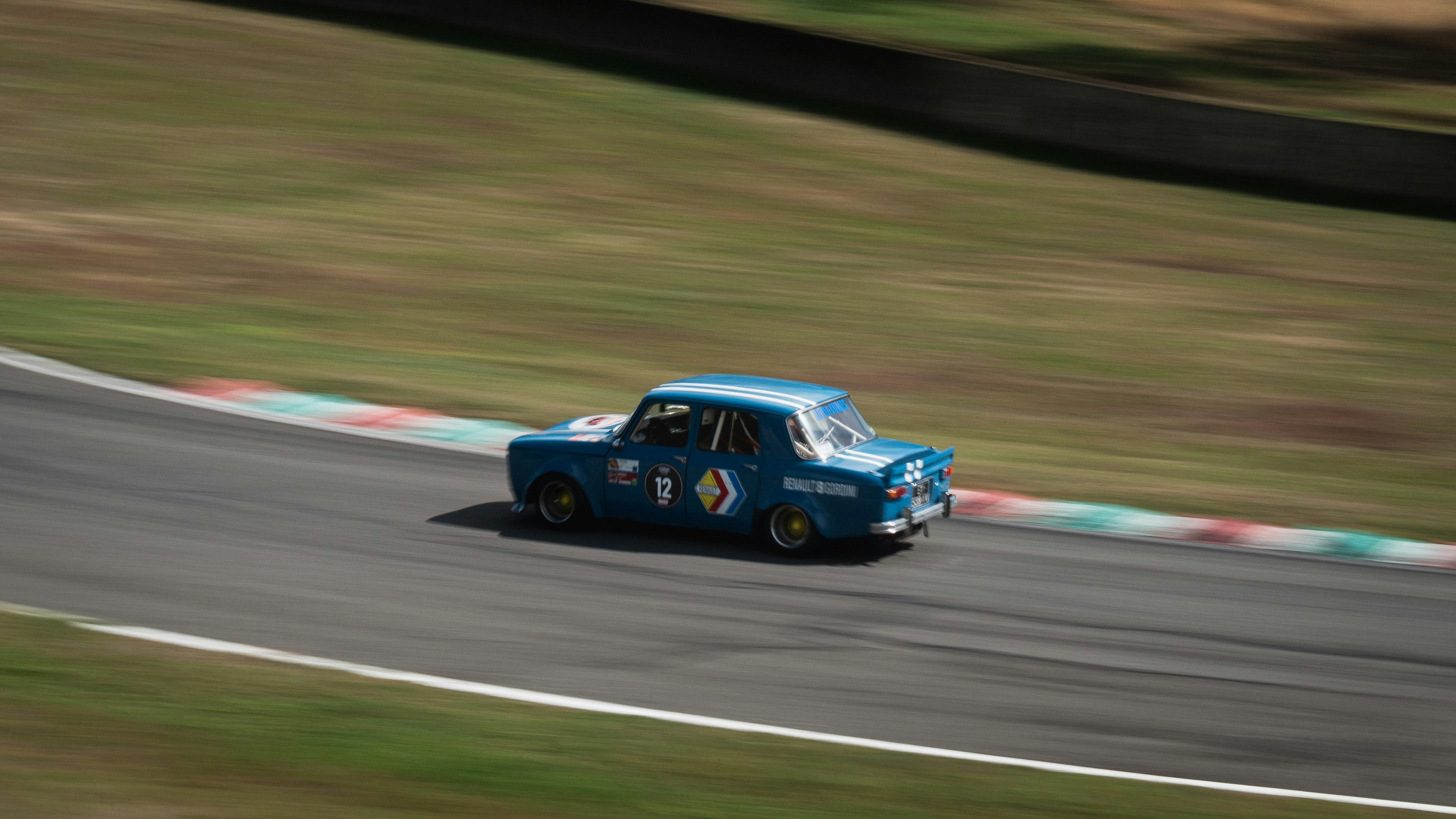 blue chevrolet camaro on race track renault google meet background