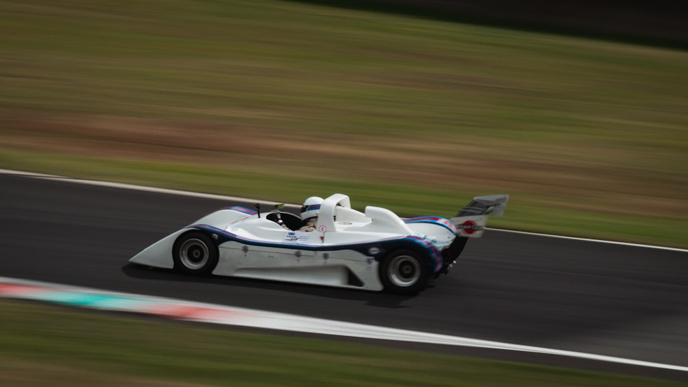 white and black sports car on road during daytime