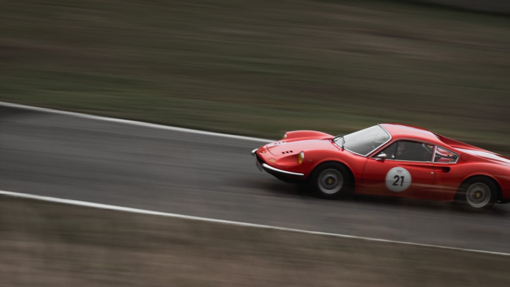 red ferrari f 1 on road