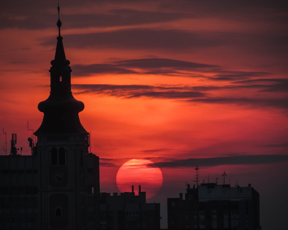 silhouette of building during sunset