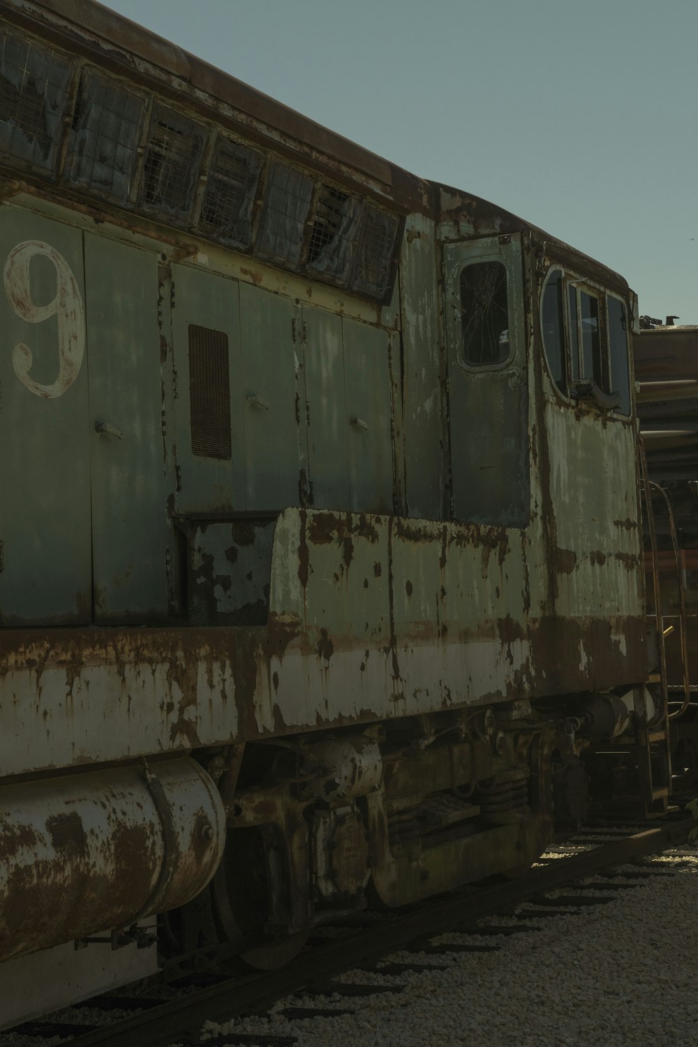 white and brown train on rail tracks