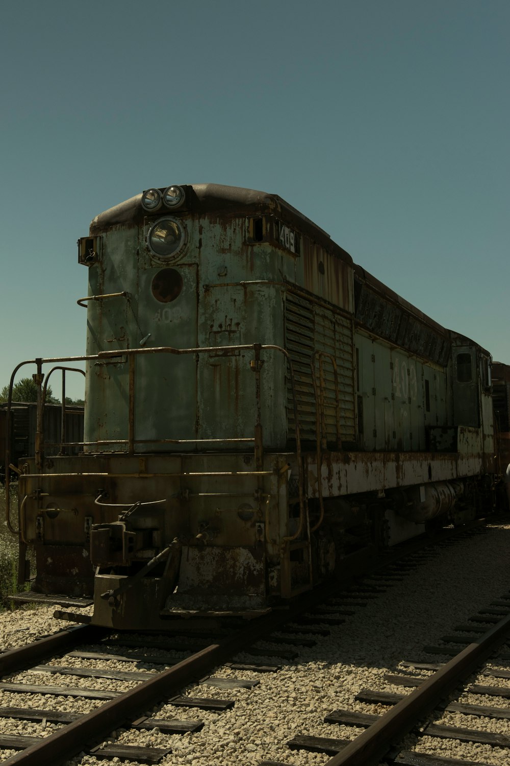 brown train on rail tracks during daytime