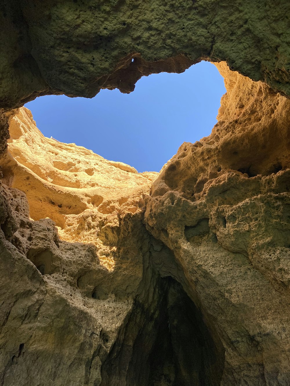 brown rock formation under blue sky during daytime