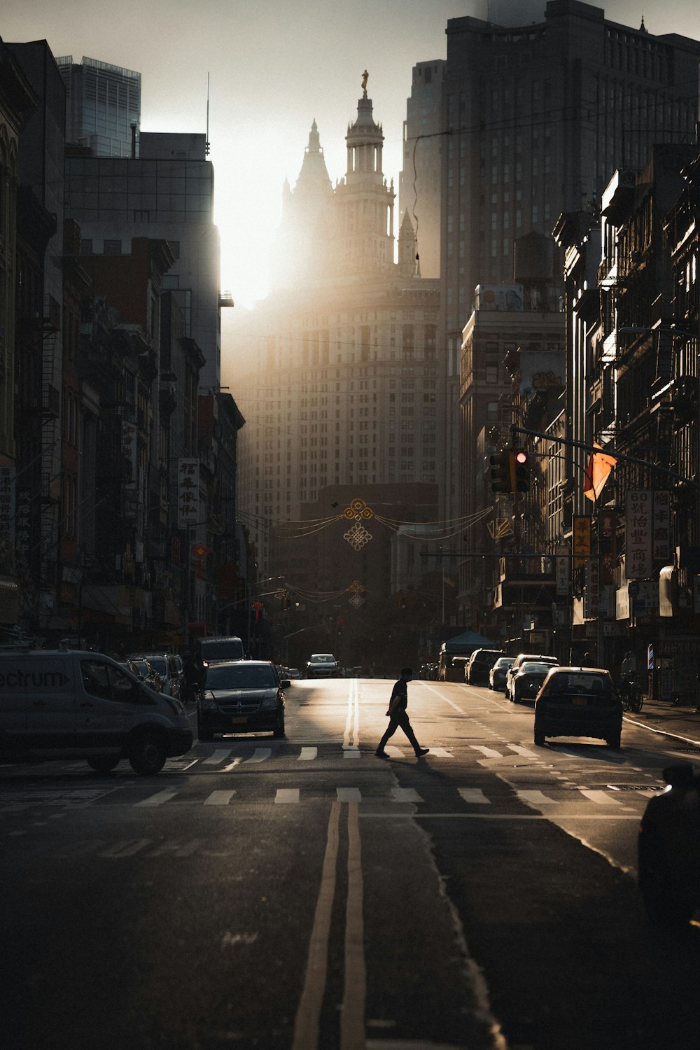 people walking on pedestrian lane in between high rise buildings during daytime