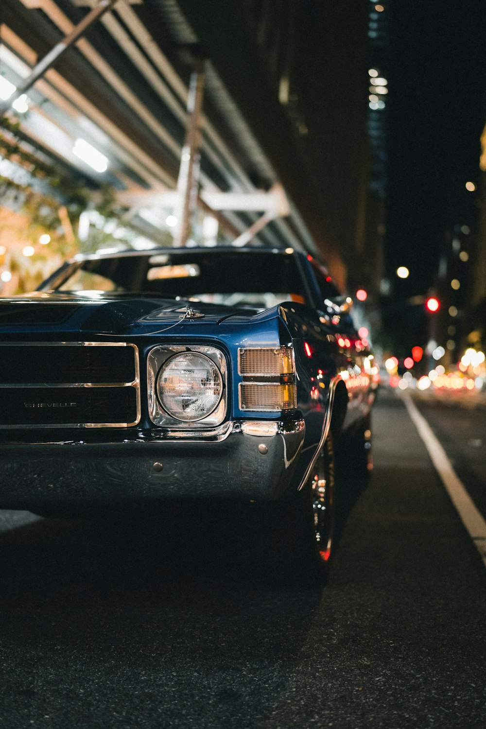 black car on road during night time