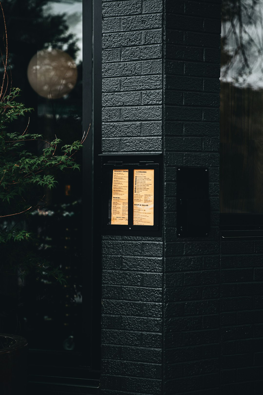 black wooden door with glass