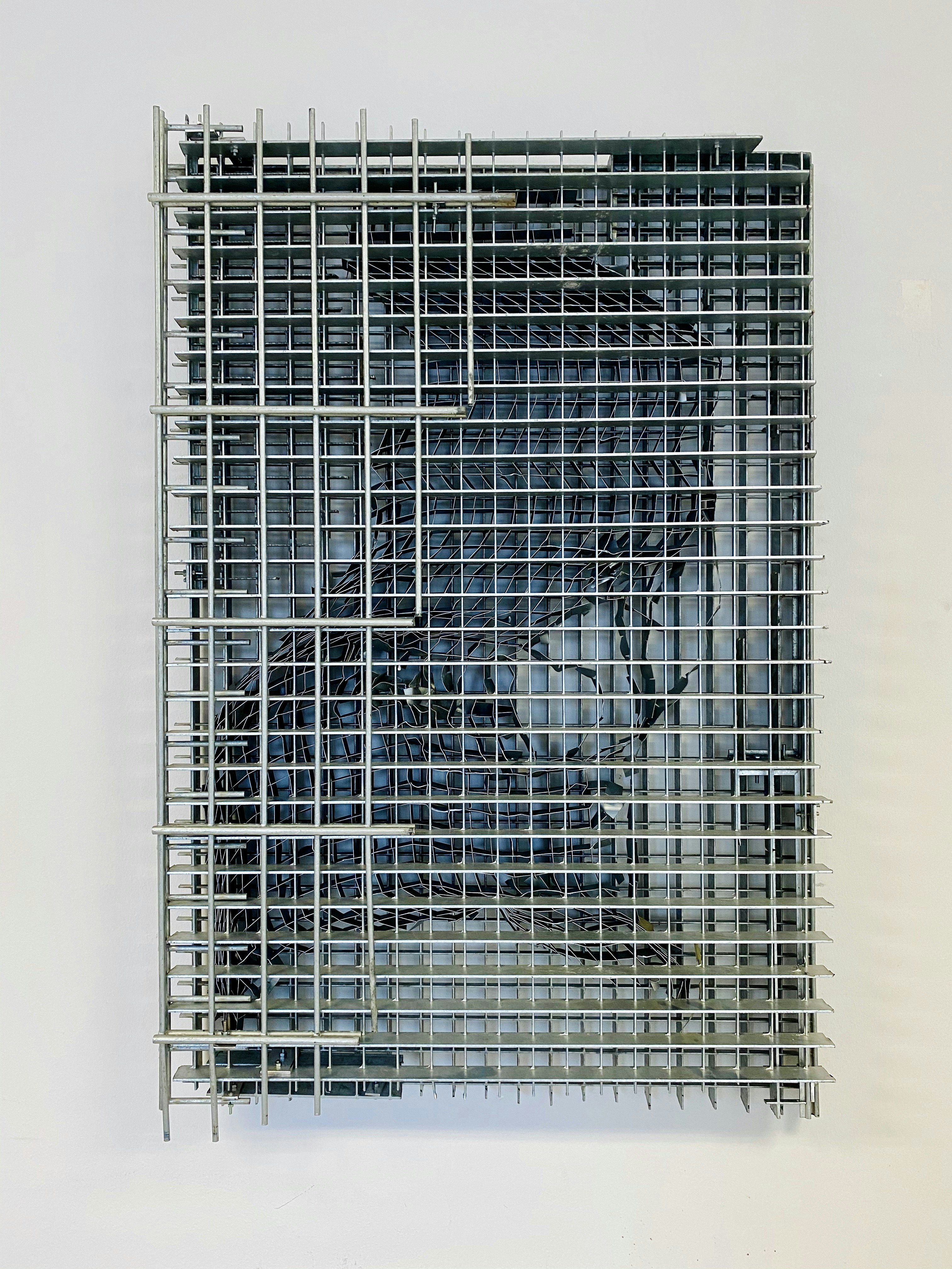 white metal screen on white wall