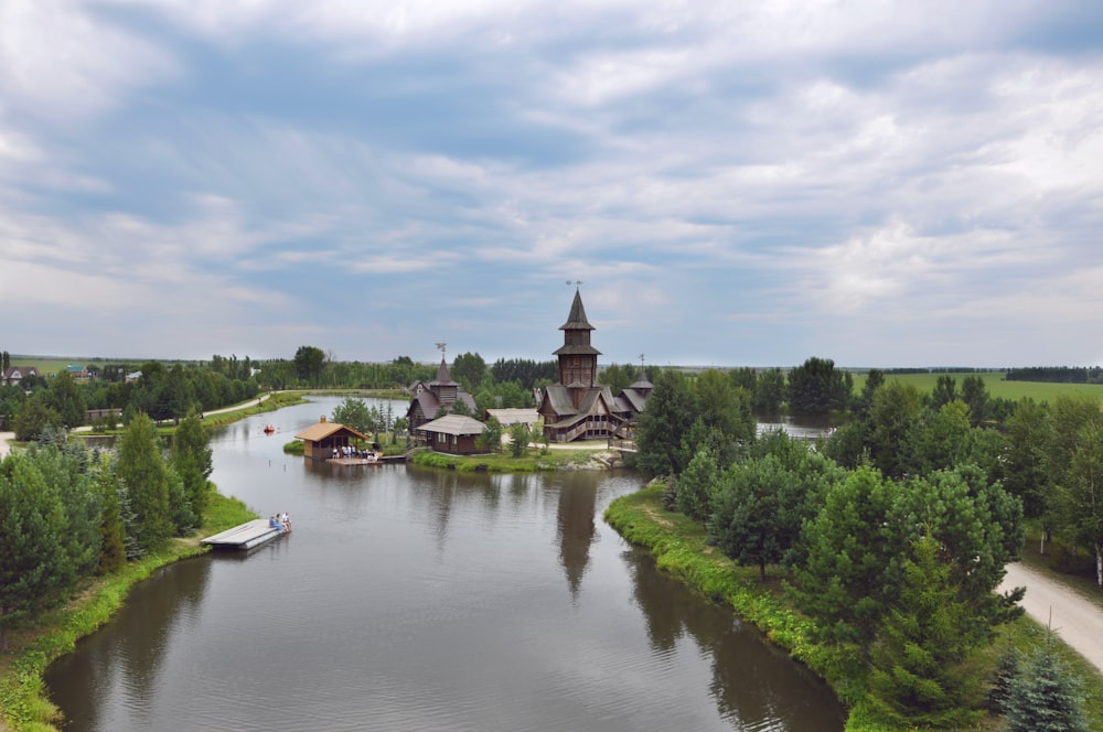 people riding on boat on river during daytime