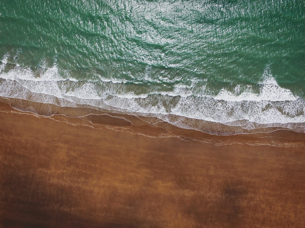 green water waves on brown wooden table