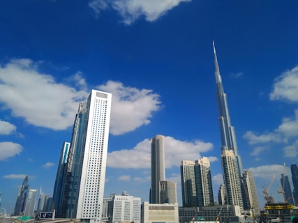 white and gray high rise buildings under blue sky during daytime