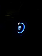 Electric blue glowing button on a dark background inviting campaign launch.