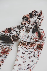 A beautifully draped silk scarf showcasing intricate patterns.