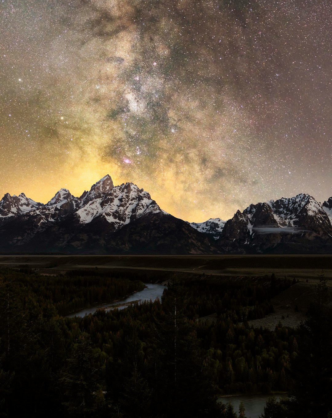 snow covered mountain under starry night