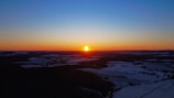 A breathtaking sunset over the snowy landscape.