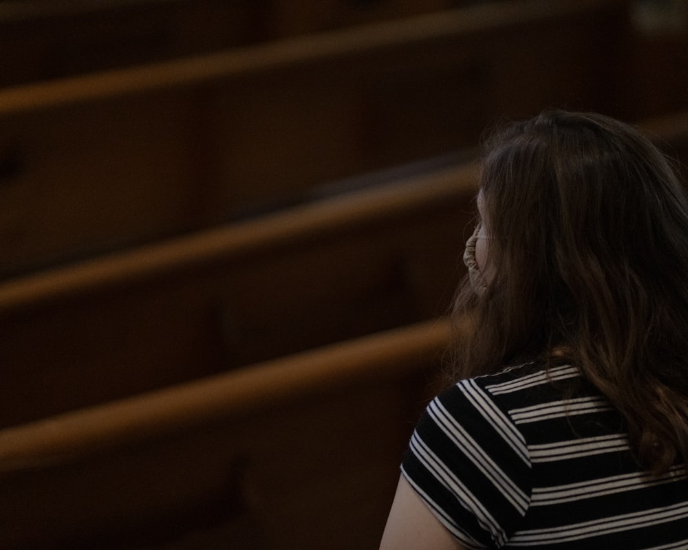 woman in black and white striped shirt