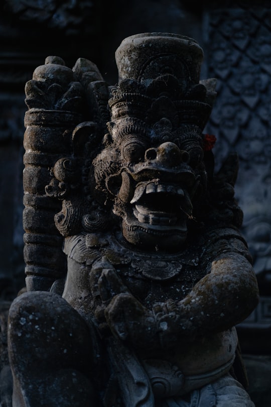 black concrete human face statue in Ubud Indonesia
