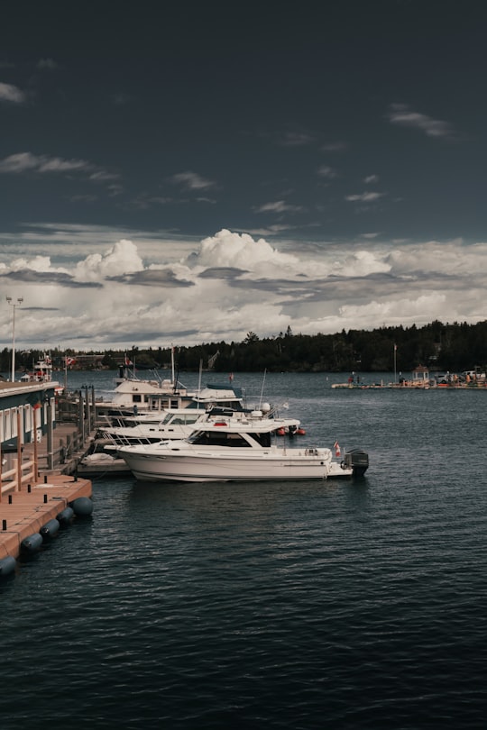 white boat on body of water during daytime in Tobermory Canada