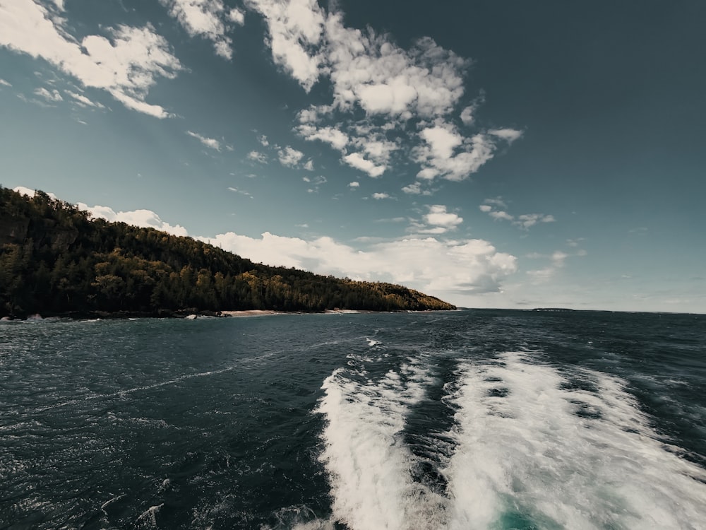 ocean waves crashing on shore during daytime