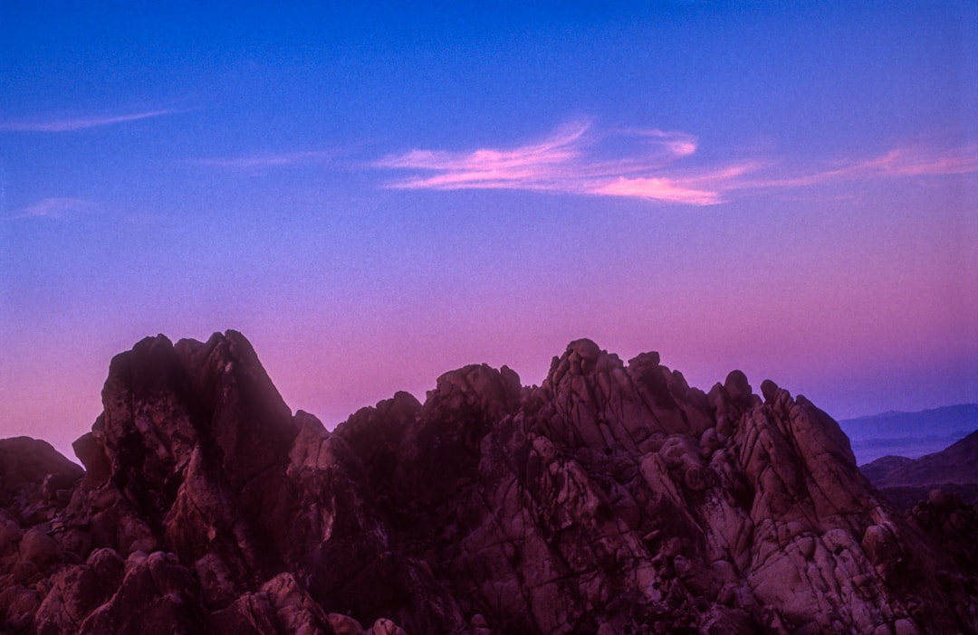 brown rocky mountain under blue sky during daytime