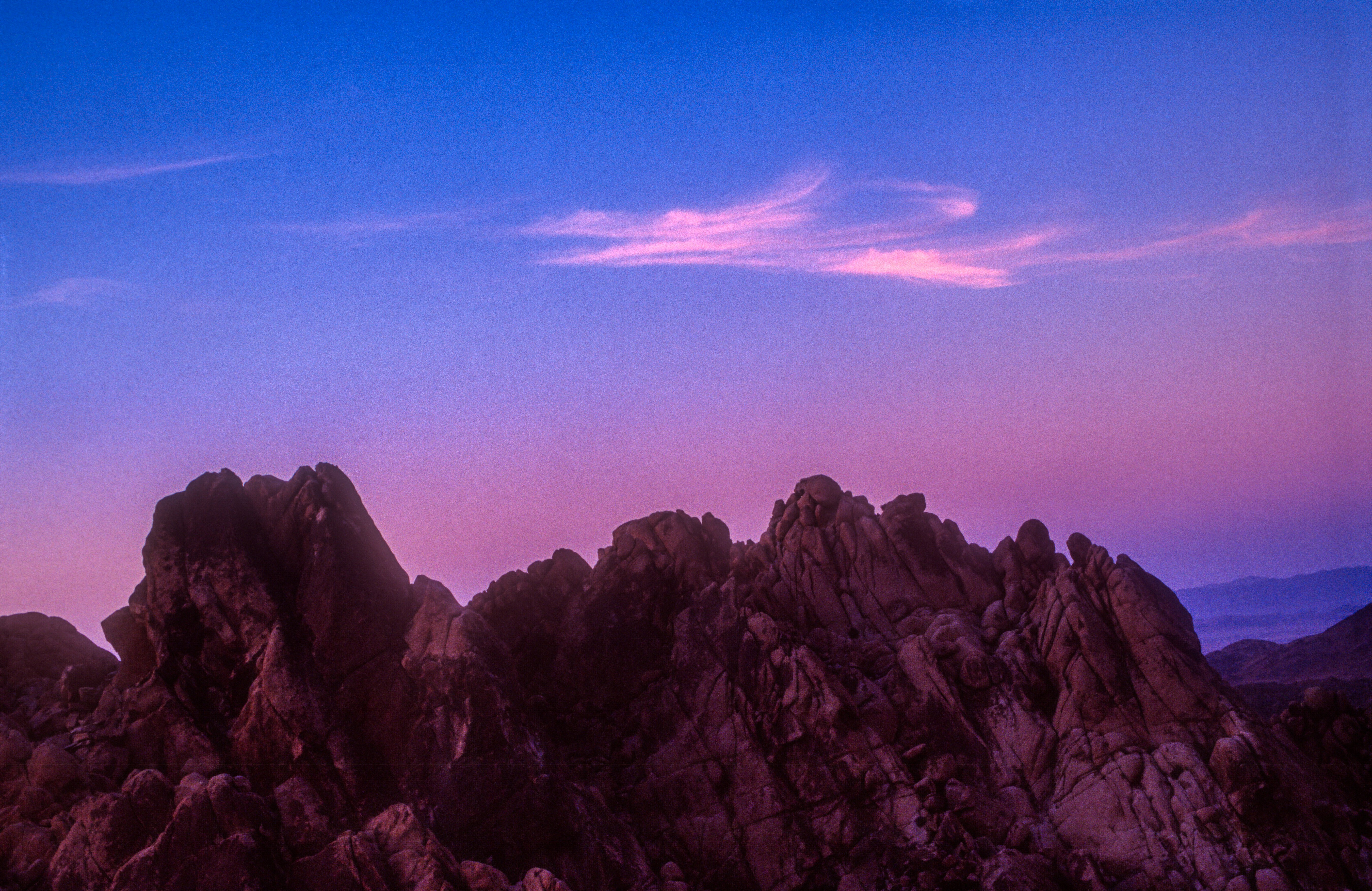 brown rocky mountain under blue sky during daytime