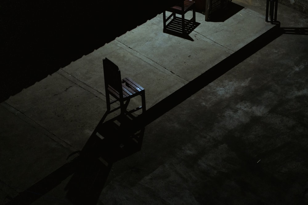 black metal chairs on gray concrete floor