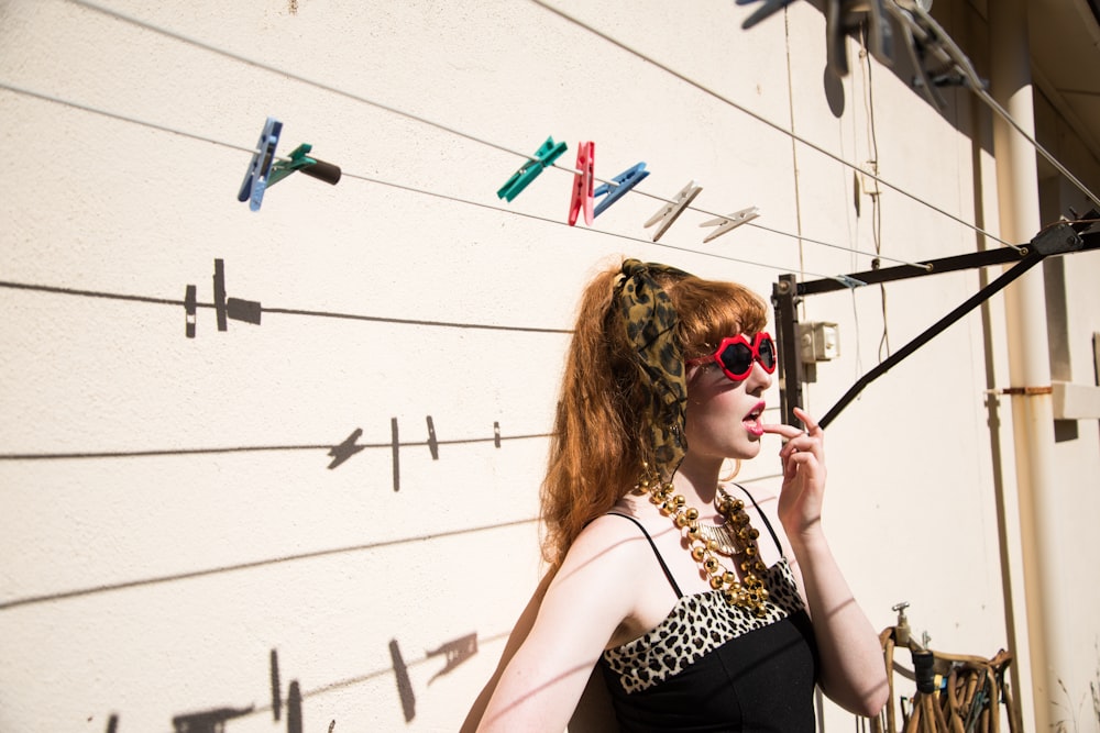 woman in black and white tank top wearing sunglasses