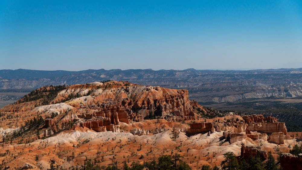 brown rocky mountain under blue sky during daytime