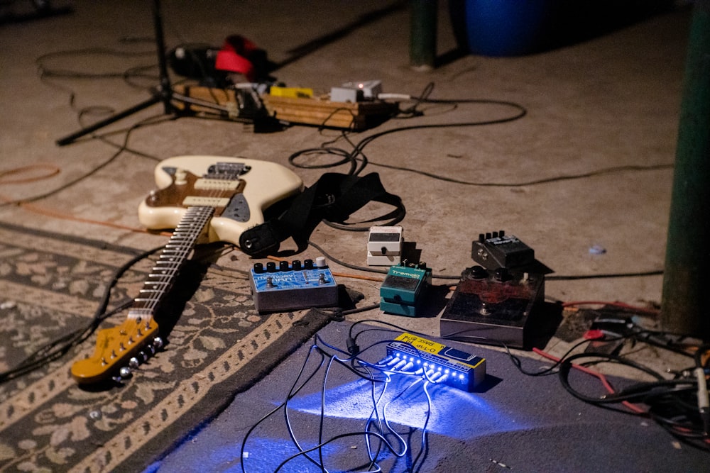 white electric guitar on blue guitar amplifier