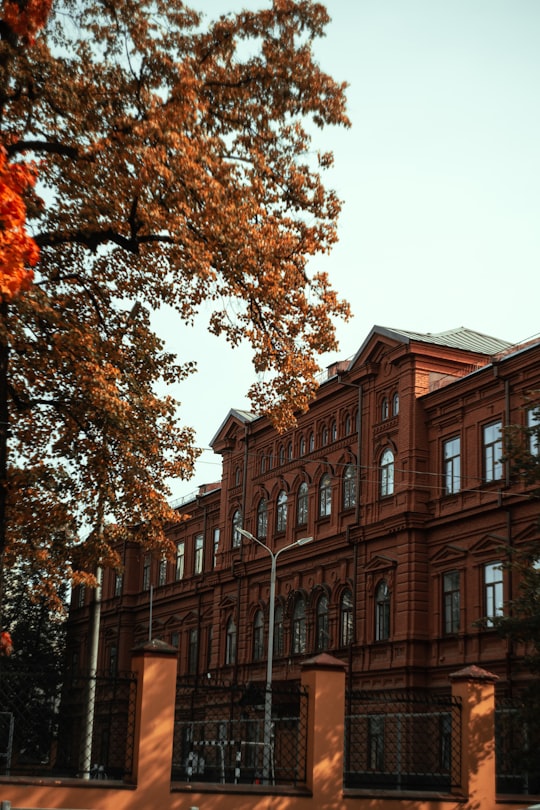 brown concrete building near trees during daytime in Kazan Russia