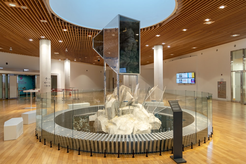 white concrete fountain in building