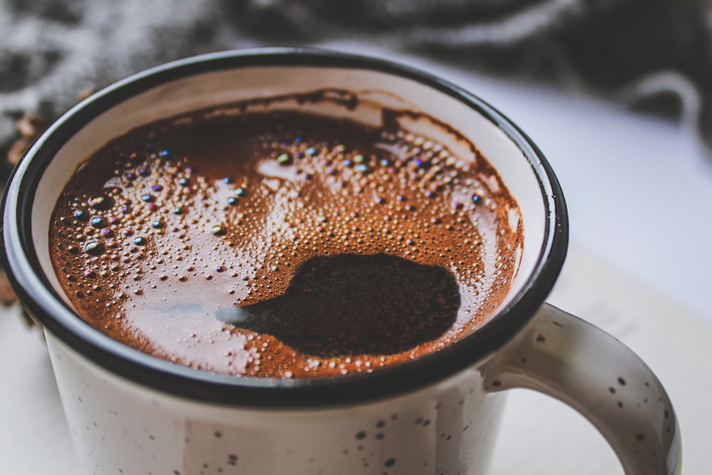 white ceramic mug with coffee